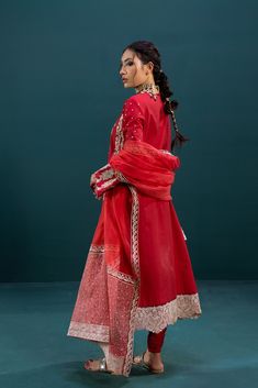 Embellished Red Salwar Kameez Pakistani Eid Dresses in an incandescent, richly embroidered design. It features an exquisitely aesthetic tapestry in shades of subtle pink and silver ivory laid out in detailed, delicate, and intricate work on a charming lawn canvas. Rendered in deep cherry red, this grandeur look is accompanied by solid trousers and a stunning embroidered organza dupatta with a contemporary doodle pattern enriched with an attractive floral border portraying vivid designs. Be the e Pakistani Eid Outfits, Pakistani Eid Dresses, Red Salwar Kameez, Aesthetic Tapestry, Salwar Kameez Pakistani, Eid Outfit, Eid Dresses, Color Palette Pink, Embroidered Organza