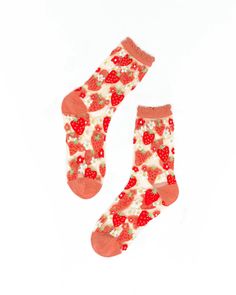 Heart-shaped pink and red strawberries interspersed with playful daisies make this sock the perfect addition to your Valentine's Day, Spring, and Summer outfits. Set against white sheer fabric for maximum color pop with a ruffle cuff for ultra sweetness. One Size. Recommended fit US W5.5-10. 200 Needle Count. 54% Nylon, 45% Combed Cotton, 1% Lycra Machine wash cold inside out with like colors. Hang dry. Do not tumble dry. Do not bleach. Do not iron. By Sock Candy White And Red Heart Socks, Sock Candy, Spring And Summer Outfits, Candle Cards, Curated Gift Boxes, Body Stickers, Red Strawberry, Halloween News, Book Candle