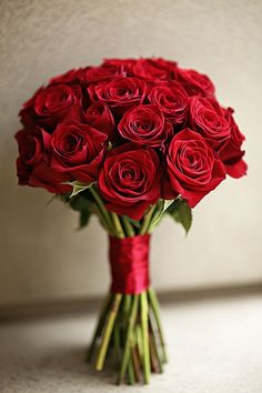 a bouquet of red roses in a vase