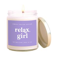 a candle with the words relax, girl on it in front of a white background