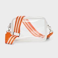 Gameday crossbody bag from Wild Fable™ with clear, transparent silhouette. Lightweight vinyl construction with a zippered compartment. Contrast-striped strap with a buckle for adjustability and side clips for attaching or removal completes the design. If you're not satisfied with any Target Owned Brand item, return it within one year with a receipt for an exchange or a refund. Wild Fable™: A look for every story Tailgate Necessities, Bed Party, Purse Game, Clear Purses, Clear Bags, Crossbody Messenger Bag, Day Bag, Mini Tote, Wild Fable