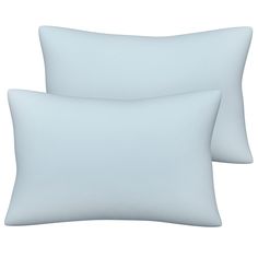 two white pillows sitting next to each other