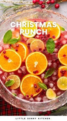 a glass bowl filled with orange slices and ice