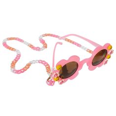 Introducing Packed Party's Daisy Sunglasses + Chain: retro-style, pink, flower-shaped sunglasses with dark lenses, adorned with smiley face details and flowers, complemented by a pink, white, and orange chain. Sunglasses For Beach, Daisy Sunglasses, 2023 Wishlist, Pink Chain, Face Details, Flower Sunglasses, Sunglasses Chain, Shaped Sunglasses, Beach Parties