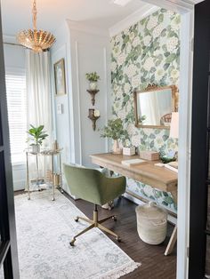 a room with a desk, chair and mirror in the corner next to a rug