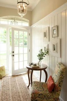 Cottage-Style Foyer Idea with Arched Transom Window, White Wooden Walls, and Tiled Flooring Garage Entrance, Foyer Ideas, Entry Ways, Street Design, Wainscoting, Mud Room, Entry Way, Home Staging, Decoration Design