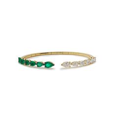 The Pear-Shaped Diamond and Emerald Cuff Bracelet is an ideal layering piece. This elegant open-style cuff features pear-shaped diamonds alternating with pear-shaped emeralds, adding a sophisticated pop of color to any look. Its modern spring system and timeless design make it an ideal addition to your jewelry collection. Details18K Yellow Gold1.79 Carats of Diamonds1.95 Carats of EmeraldsDiamond Quality F-G color, VVS-VS ClarityManufactured in Italy Emerald And Diamond Bracelet, Emerald Bracelets, Diamond Choker Necklace, Diamond Choker, Pear Shaped Diamond, Watch Necklace