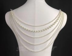 Material: Imitation Pearl  Size: The first chain (the shortest one, excluding the buckle on both sides) is about 36.5cm long  The 5th chain (the longest one, excluding the buckles on both sides) is about 52cm long  If you need to change the length, please contact me.  Thank you Elegant Wedding Body Chain With Adjustable Chain, Elegant White Body Chain For Wedding, Silver Body Chain With Clavicle Design For Wedding, Elegant Pearl Necklace With Chain For Wedding, Elegant Wedding Pearl Necklace With Chain, Pearl Backdrop Necklace With Adjustable Chain For Parties, Party Pearl Backdrop Necklace With Adjustable Chain, Elegant Pearl Body Chain For Wedding, White Clavicle Chain Backdrop Necklace For Wedding