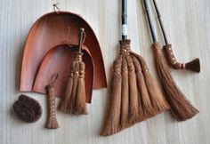 three pieces of wood with tassels and other items