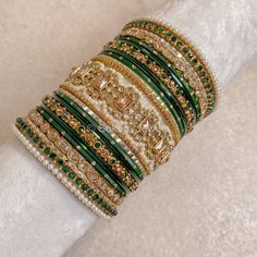 A Large stack of luxurious antique Gold bangles with vibrant green shades and stunning Champagne crystal kada bangles.  Perfect for brides or those wanting to make a statement. Ready to Ship! Antique Gold Bangles, Cristal Champagne, Bridal Survival Kit, Kada Bangles, Bangle Stack, Bridal Jewellery Inspiration, Colorful Bangles, Bangle Box, Anklet Designs