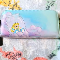 Awesome Loungefly Disney Alice In Wonderland Wallet. It Has A All Around Zipper Closure With Slots For Credit Cards And A Id Slot. There Is A Large Compartment For Bills. Great For Everyday Use. Blue Disney Wallets For Travel, Disney Travel Wallets In Blue, Disney Blue Travel Wallets, Disney Blue Wallets For Gifts, Disney Blue Wallets For Gift, Disney Wallet, Denim Wallet, Mermaid Fin, Skull Wallet