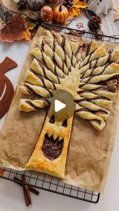 a piece of bread that looks like a tree is on a table with other items