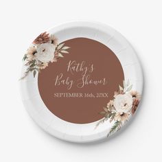 a paper plate with flowers on it that says, kitty's baby shower september 16th