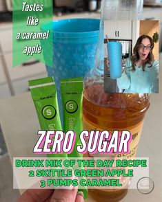 a person holding up a drink in front of a blender with the words zero sugar on it