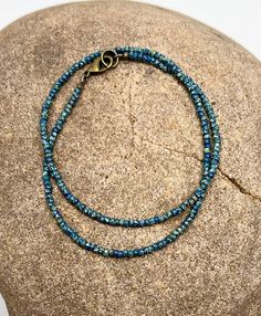 Minimalist Style Seed Bead Necklace Beaded Layering Necklace Simple Boho Dark Teal Blue Green Picasso M Minimalist Blue Beads For Gift, Handmade Blue-green Beaded Necklaces, Blue Oval Beads Single Strand, Minimalist Handmade Blue Beaded Necklaces, Blue Single Strand Oval Beads, Minimalist Blue Jewelry With Tiny Beads, Blue Oval Single Strand Beads, Minimalist Single Strand Blue Jewelry, Minimalist Blue Single Strand Jewelry