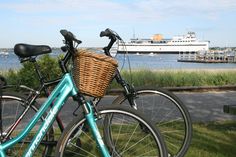 two bicycles parked next to each other near the water