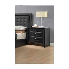 a night stand with two drawers and a lamp next to it on a hardwood floor