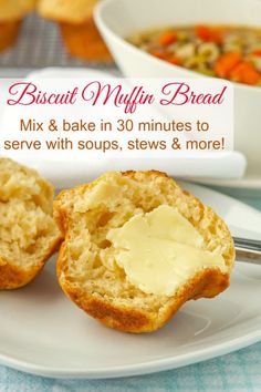 a white plate topped with muffins next to a bowl of soup