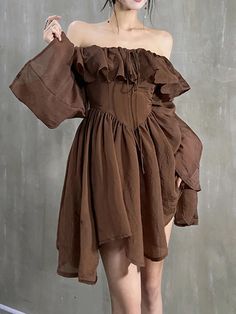 Relive the quintessential Y2K style with our Brown Y2K Dress. Dive into retro-modernized elegance with this unique piece, featuring a flared cut embellished with long sleeves and irregular ruffles. It's a perfect fusion of style and comfort for the spring and summer seasons. Vintage Brown Dress, Backless Short Dress, Brown Y2k, Y2k Dress, Flare Long Sleeve, Long Sleeve Casual Dress, Long Sleeve Short Dress, Ruffle Mini Dress, Dress For Short Women