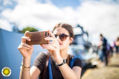 a woman taking a photo with her cell phone