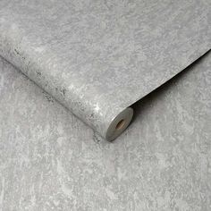 a roll of silver glitter paper on top of a table