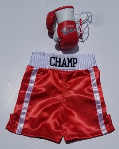 "Do you need something incredible for you new fighter baby ? About this adorable boxing Boxing set? It comes with shorts personalized with baby's name, plus prop gloves. ( this gloves won't fit on the baby's hands, its just a prop) For gloves that will fit baby's hands please click on the link below: https://www.etsy.com/MelissasStitches/listing/686706713/baby-boxing-set-gloves-and-shorts?utm_source=Copy&utm_medium=ListingManager&utm_campaign=Share&utm_term=so.lmsm&share_time=156 Fitted Shorts For Playtime, Boxing Outfit, Boxing Clothes, Baby Gloves, Baby Hands, 2nd Baby, Baby Newborn, Clothing Sets