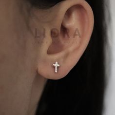 These small cross earrings are crafted from high-quality sterling silver, featuring a polished finish for a sleek look. Their delicate size makes them perfect for everyday wear. Secured with butterfly clasps, they offer a comfortable fit. A timeless and versatile accessory. * Design: Cross * Material: High-quality 925 sterling silver. * Tarnish resistant + Hypoallergenic * Size: 7x4 mm * Complimentary Gift Wrapping * Worldwide Tracked Delivery * Returns & exchanges accepted Next-Day Delivery Ser Silver Cross Stud Earrings, Cross-shaped Stainless Steel Earrings For Pierced Ears, Nickel-free Cross-shaped Sterling Silver Earrings, Silver Cross-shaped Stainless Steel Earrings, Cross Stud Earrings, Earrings Cross, Accessory Design, Cross Earrings Studs, Cross Gift