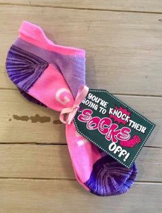 two pairs of pink and purple socks with the tag saying, you're not trying to