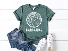 Badland Shirt - Badland National Park - South Dakota Shirt - Unisex Clothing - Nature Lover Shirt - Adventure Shirt - Comfortable T-shirt Sizing, Colors and Material ? These shirts are unisex fit Bella Canvas premium t-shirts. Heather colors are cotton/poly blend so they never shrink. Plain colors like black, pink or military green (not heather ones) are 100% cotton shirts. If you prefer 100% cotton like me, just go with a plain color. Red would be nice for Christmas theme. Size charts are on th Camping Shirts Funny, Camp Shirts, National Park Shirt, Family Reunion Shirts, Reunion Shirts, Camper Shirt, Girls Trip Shirts, Family Vacation Shirts, Adventure Shirt