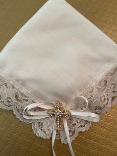 A very special ivory hanky with a gold cross and delicate lace edging. It is a precious keepsake for the bride to wipe away her happy tears! Hanky is boxed for gift-giving.  Please visit our store for other Precious Keepsakes. We specialize in Weddings.  Thank you everyone!! Wishing you the best wedding day ever! Best always, Elegance by Gianna Gift For The Bride, Precious Gift, Happy Tears, Gold Cross, Lace Edging, Bride Gifts, Wedding Favors, The Bride, Wedding Gifts