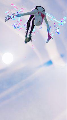 a woman flying through the air on top of a pair of skis in front of a blue sky