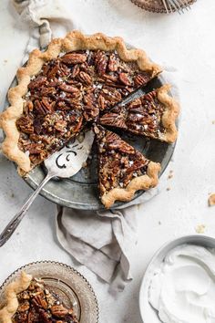 a pecan pie with one slice missing from it