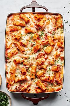 a casserole dish filled with pasta and sauce