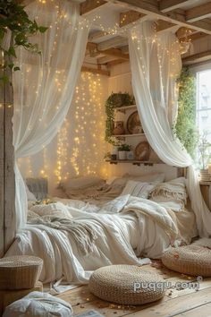 a bedroom with white curtains and lights on the ceiling