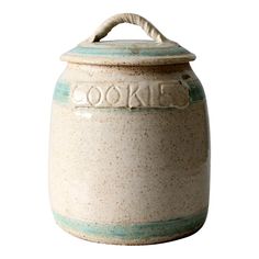 a ceramic cookie jar with the word cookies written on it's front and bottom