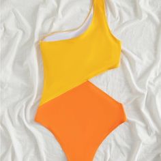 Cool, Bright Color Block Swimsuit. Never Worn. Yellow Beachwear Bodysuit For Swimming, Yellow Sleeveless Bodysuit For Pool, Yellow Bodysuit For Pool And Beach Season, Casual Color Block Bodysuit For Summer, Yellow One Piece For Beach Season Vacation, Yellow Beachwear One-piece For Vacation, Trendy Yellow One-piece Bodysuit, Yellow One-piece Bodysuit For Swimming, Yellow One Piece Swimwear For Beach