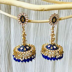 A beautiful handpainted meenakari jhumki earring.It's unique design is surely a show stopper for any occasion. High quality material and workmanship for this piece to be your forever friend. Product Include: Earrings Explore our shop for more beautiful pieces: https://www.etsy.com/shop/KoohooUS Care tips: - Keep away from contact with nail polish removers, perfumes, body oils, and other household chemicals - Put the jewelry last while getting ready as hair styling products may damage metal polis Meenakari Earrings, Nail Polish Removers, Photography Settings, Hair Styling Products, Earrings Indian, Body Oils, Kundan Earrings, Jhumka Earrings, Pool Spa