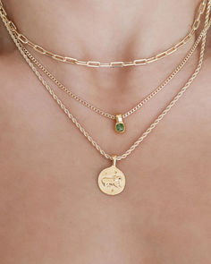 Curate the perfect gold necklace stack with three stunning pieces that blend elegance and meaning. Start with a sleek link chain for a timeless foundation, then layer the Edel necklace featuring a vibrant emerald gemstone for a pop of color and luxury. Complete the look with a personalized touch—an Aries zodiac necklace that adds both charm and personality. This gold jewellery stack is the ultimate combination of sophistication and style, perfect for every occasion. Gold Necklace Stack, Minimalist Wardrobe Essentials, Bold Statement Necklaces, Necklace Stack, Winter Jewelry, Aries Zodiac