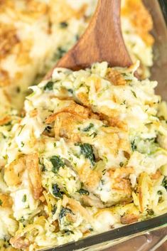 a casserole dish with broccoli, cheese and bread mixed in it