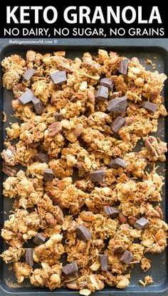 keto granola on a baking sheet with chocolate chunks and text overlay that reads, no dairy, no sugar, no grains