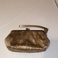 Never Used This Bag But Don’t Have The Original Tags To It. It’s A Gold Signature Clutch Bag. Can Fit Your Phone, Keys, And Other Small Items. Elegant Satchel Cosmetic Bag, Formal Rectangular Coach Coin Purse, Elegant Cosmetic Bag With Detachable Handle, Elegant Gold Cosmetic Bag For Everyday, Gold Rectangular Coach Coin Purse, Elegant Cosmetic Bag With Detachable Handle For Everyday Use, Coach Clutch With Removable Pouch For Formal Occasions, Elegant Handheld Shoulder Bag With Zipper Pouch, Elegant Gold Coach Coin Purse