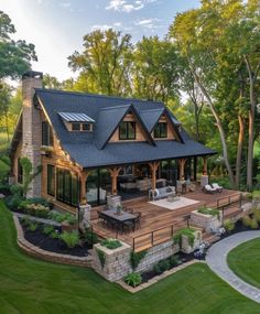 a large house with a deck and patio in the middle of it's yard