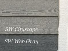 the words sw cityscape and sw web gray are painted on wood siding