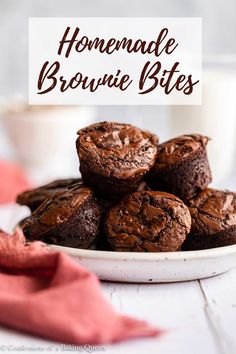 chocolate brownie bites stacked on top of each other in front of a glass of milk