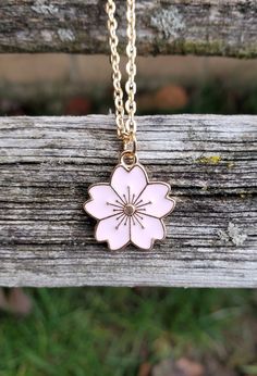 This cute little Sakura flower (cherry blossom) necklace would make a great gift. You can choose between 5 colors: pink, red, white, turquoise, and black. The flower measures 5/8 inch wide. You can choose the length and color of your necklace at checkout. This would make a great gift for a bridesmaid or a birthday, an anniversary or Christmas. All jewelry items come in a gift box. Japanese Necklace, Sakura Necklace, Flower Cherry Blossom, Lilac And Black, Cherry Blossom Necklace, Pretty Jewelry Necklaces, Edgy Jewelry, Memory Locket, Sakura Flower