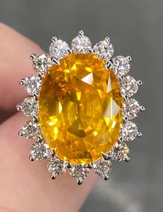 ALL THESE PHOTOS WERE TAKEN WITH AN ORDINARY IPHONE & HAVE NOT BEEN EDITED OR ENHANCED IN ANY WAY.  Up for Sale is a Phenomenal Large Natural Vivid Yellow Sapphire & Diamond Halo Ring in Solid Platinum. This Ring was made by us Here in New York City & is of the Finest Quality. The Face of this ring (sapphire & halo together) measures approx 25 x 20 mm  Center Stone is a Gorgeous GEM Quality Natural GRS Certified 16.03 Ct Oval Brilliant Cut "Vivid Golden Yellow" Sapphire that measures approx 17 x 13 mm & was mined in Ceylon (Sri Lanka.) In Addition to the Special Color Designation, This Incredible Sri Lankan Sapphire has received the Notable "Vibrant Brilliancy" Award from GRS for having Ideal Proportions, A High Amount of Color Reflection & Top Brilliancy. A Rare & Important Sapphire this Yellow Sapphire Rings, Vvs Diamond, Yellow Diamond Rings, Ring Sapphire, Platinum Diamond Rings, Ceylon Sapphire, Bling Rings, Halo Diamond Ring, Fabulous Jewelry