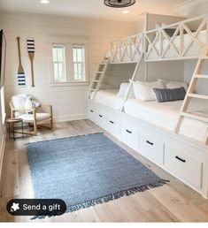 a room with bunk beds in it and a rug on the floor next to them