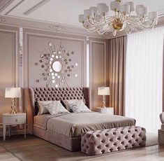 a bedroom with a large bed and chandelier