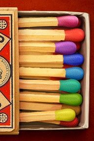 a box filled with lots of different colored toothbrushes