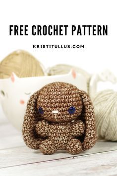 a small crocheted bunny sitting next to balls of yarn with text overlay that reads free crochet pattern